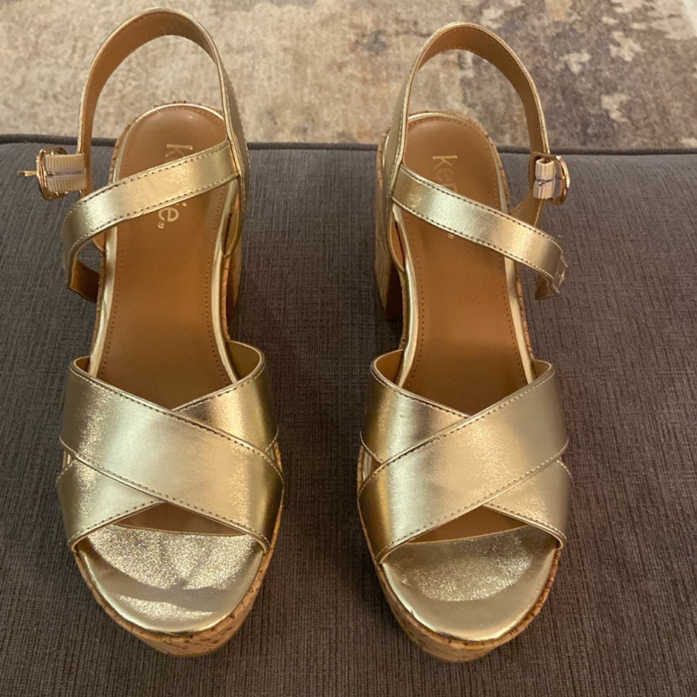 Gold platform sandals by Kensie